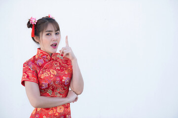 Portrait beautiful asian woman in Cheongsam dress on white background,Thailand people,Happy Chinese new year concept,Happy  asian lady in chinese traditional dress