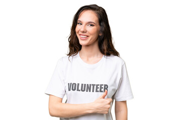 Young volunteer caucasian woman over isolated background giving a thumbs up gesture