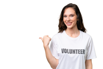 Young volunteer caucasian woman over isolated background pointing to the side to present a product
