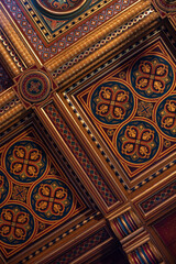 part of the decor and the material from which it is made;
symmetrical decorative patterns on a wooden plinth
