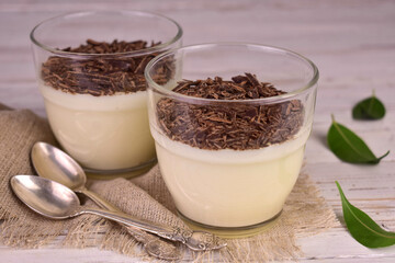 Vanilla dessert with grated chocolate. Vanilla pudding.