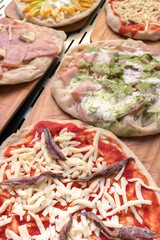 Raw pizzas