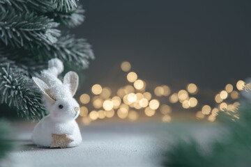 a rabbit symbol of 2023 among the lights, garlands