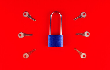 One metal blue lock with six keys on a red background