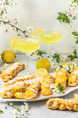 Limoncello. Traditional italian homemade alcoholic drink in glass with pieces of lemon, sweet...