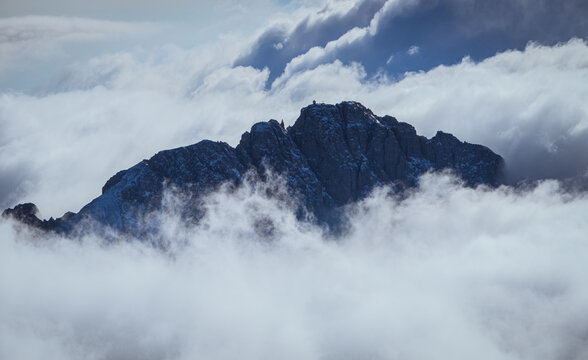 The mountains of Lake Como with the first fresh snow and clouds, seen from the Brioschi refuge, near the village of Mandello del Lario, Italy - November 2022.