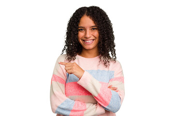 Young Brazilian curly hair cute woman isolated smiling cheerfully pointing with forefinger away.