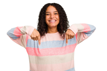 Young Brazilian curly hair cute woman isolated points down with fingers, positive feeling.