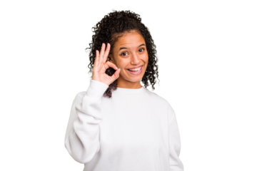 Young Brazilian curly hair cute woman isolated cheerful and confident showing ok gesture.
