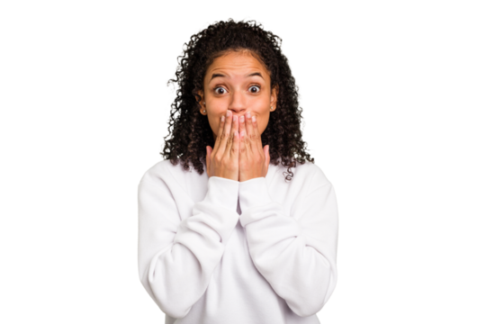 Young Brazilian curly hair cute woman isolated shocked covering mouth with hands.