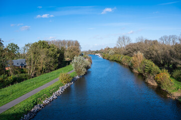 Fototapeta na wymiar Bridge view over the River Dender and nature surroundings around Gijzegem, Belgium
