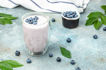 Blueberry jogurt, Homemade berry smoothie. Healthy eating. Diet food yogurt on a light background, banner, menu, recipe place for text, top view