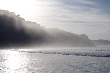 Sunset over a foggy beach in Costa Rica