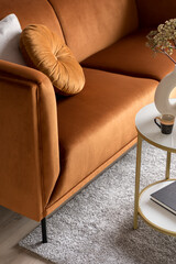 Velvet, ocher colored sofa, close-up