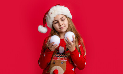 xmas teen girl in santa hat hold snowball. teen girl wear sweater hold xmas snowball. merry xmas.