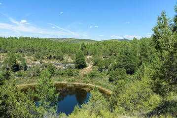 Naklejka na ściany i meble Canada del Hoyo Lagoons Natural monument makes up a rugged area with hiking routes amid karst rock formations, pine forest & sinkholes, Cuenca, Spain