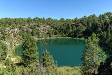 Canada del Hoyo Lagoons Natural monument makes up a rugged area with hiking routes amid karst rock formations, pine forest & sinkholes, Cuenca, Spain