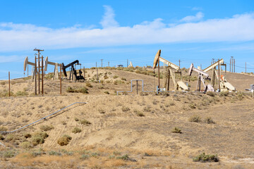 Pumpjacks in a oil field on a clear autumn day