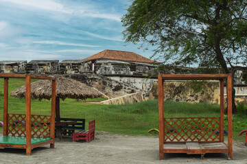 Fototapeta na wymiar bocachica colonial structure beach bed on the island of tierra bomba, located in cartagena, colombia.