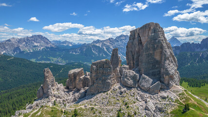 Climbing in Cinque Torri,Dolomites,Italy.Five towers and rock formations close to Cortina d'Ampezzo attract many tourists.Picturesque Dolomite Alps,active summer holiday,steep cliffs.Adventure concept