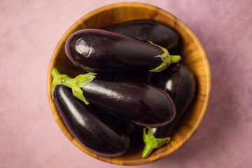 Eggplants in a wooden bowl