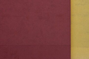 Minimalist abstract wallpaper with simple lines in bordeaux and yellow, close up of a wall