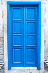 Fototapeta premium Charming House with wooden old blue door.