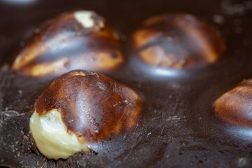 Brown chocolate with whole hazelnuts