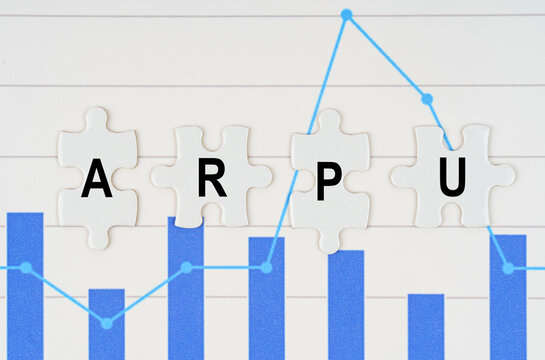 On business reports - diagrams are puzzles with the inscription - ARPU