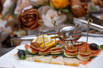 caviar and fish meal with olives on the buffet table