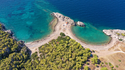 Aerial drone top down photo of scenic half moon shaped crystal clear sea beach of Milokopi near famous lake Vouiagmeni, Loutraki, Perachora, Greece