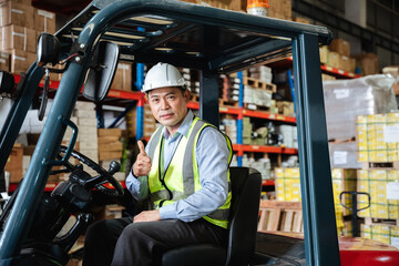 Fototapeta na wymiar Warehouse worker working with a forklift in a warehouse or storehouse.