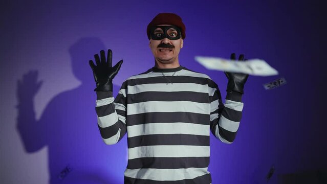 funny thief in mask and Prison Uniform police lights and fraudster