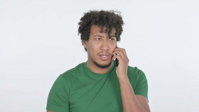 Aggressive African Man Angry on Smartphone on White Background