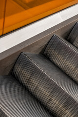 Details of the stairs of an escalator.