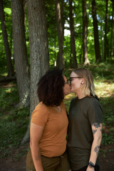 Portrait of female LGBTQ couple in campground missing