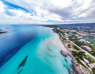 Aerial view of La Pelosa beach under a cloudy sky