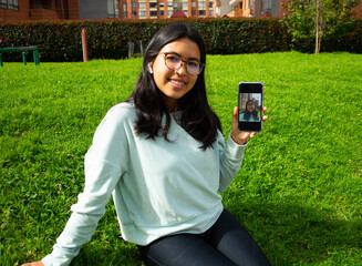 Woman taking a selfie photo with phone