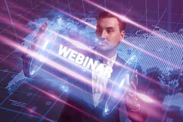 Business, Technology, Internet and network concept. Young businessman working on a virtual screen of the future and sees the inscription: Webinar