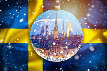 Swedish flag evening snow view through glass christmas ball