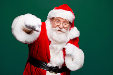 Fight boxer boxing attack strength hit knock gifts and presents at good price. Grandfather stylish Santa with white beard in headwear and costume have sport training stand isolated on red background