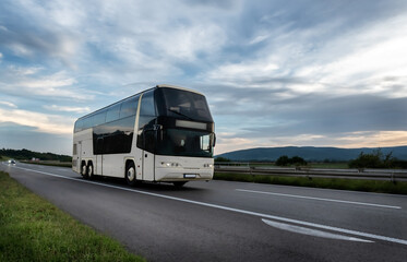 Fototapeta na wymiar White Bus on the country highway road road