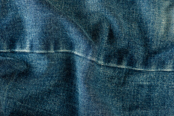 Texture of denim close-up. Jeans seam with place for text