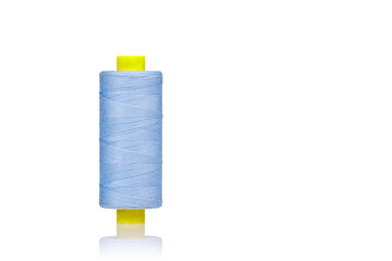 a skein of threads of blue color macro on a white background