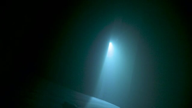 Police Inspector Investigates in Dark Bedroom with a Flashlight