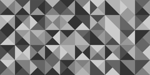 Fototapeta na wymiar Background monochrome of triangles in gray tones.