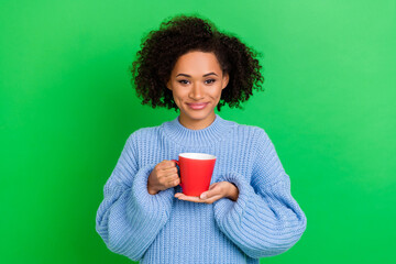 Photo of lovely adorable nice friendly girl with wavy hairstyle dressed blue pullover holding cup...