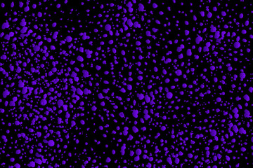 Abstract background of purple spots on a black background