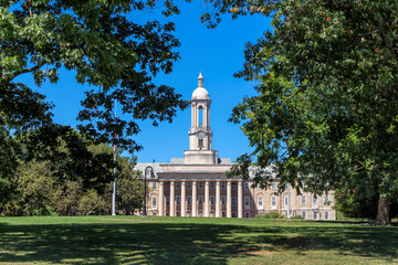 The Old Main building on the campus of Penn State University in sunny morning, University Park, State College, Pennsylvania.	 - 549838988