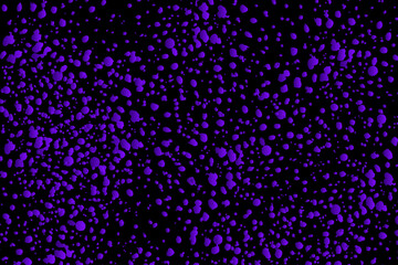 Abstract background of purple spots on a black background